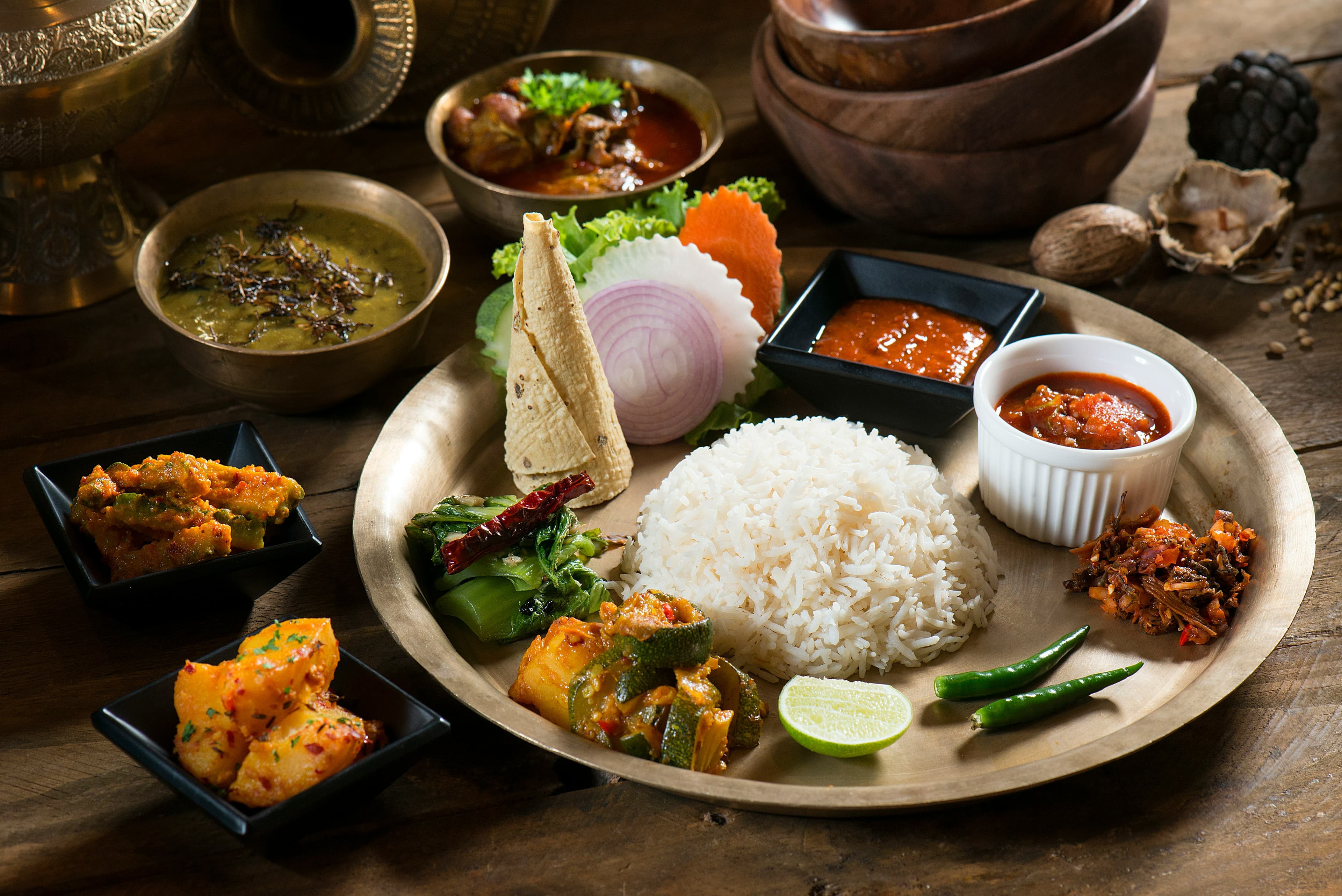 Authentic Nepali Thakali dal bhat set with rice, lentils, curry, and vegetables